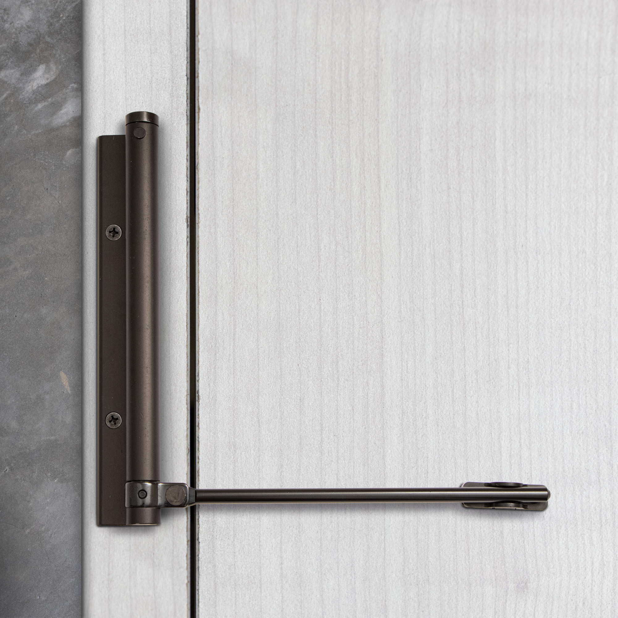 Bras à ressort ferme porte, a corps très fin en Aluminium anodisé noir
