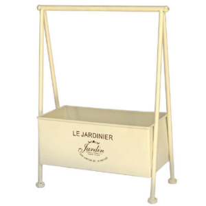 Jardinière en métal beige sur pieds.